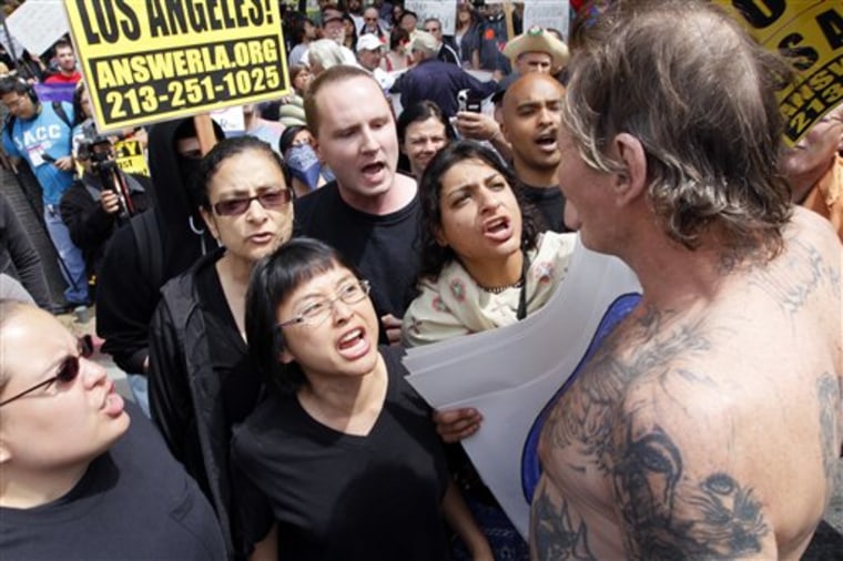 A man is confronted by an anti-Nazi crowd during a white supremacist rally at Los Angeles City Hall on Saturday. Hundreds of counter-protestors carrying anti-Nazi signs have 
